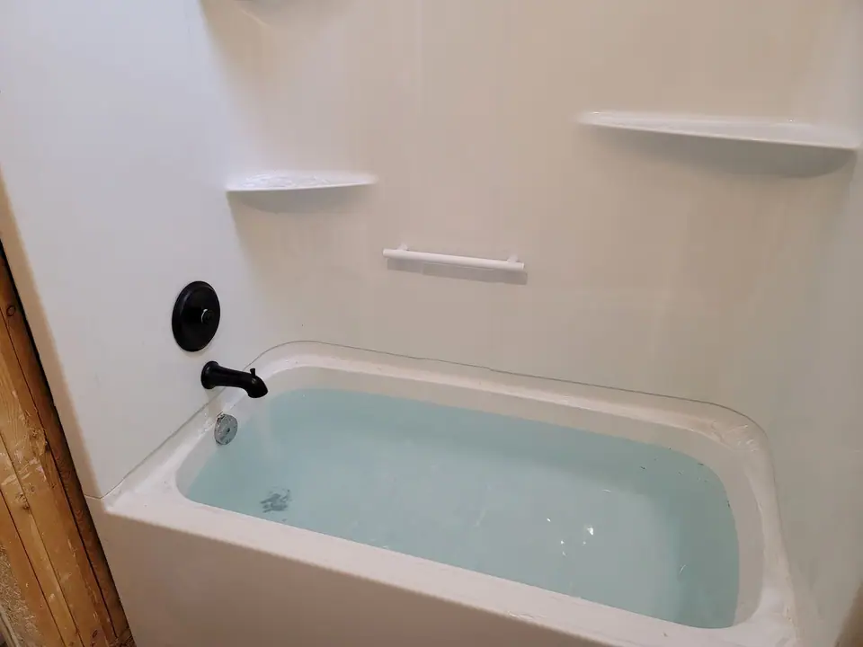 Bathroom rebuild with a skylight well and wood vanity, photo 8 of 11 (in progress)