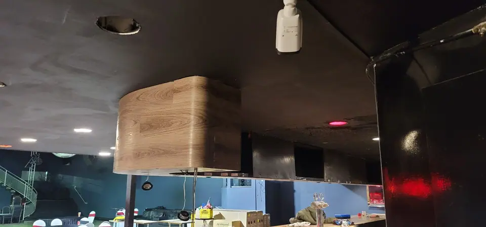 Commercial interior: curved wood-look bulkhead and service wall, photo 9 of 15