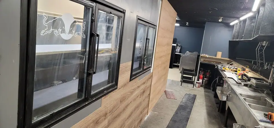 Commercial interior: curved wood-look bulkhead and service wall, photo 11 of 15