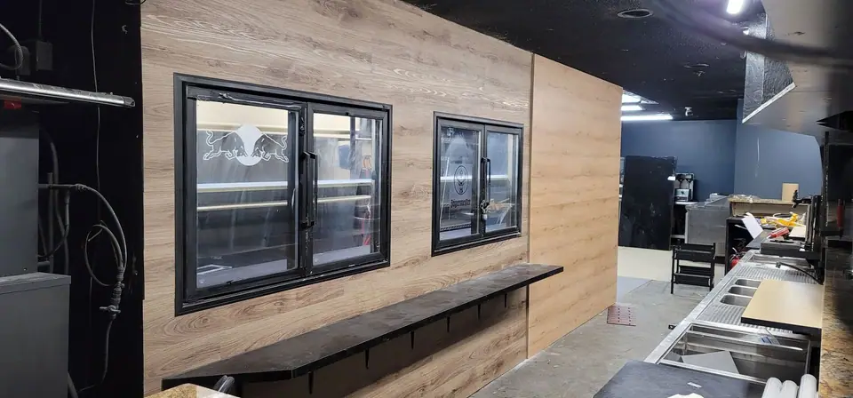 Commercial interior: curved wood-look bulkhead and service wall, photo 13 of 15