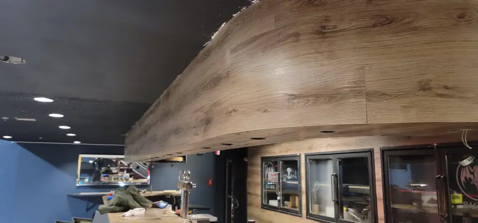 Commercial interior: curved wood-look bulkhead and service wall, photo 10 of 15 (in progress)