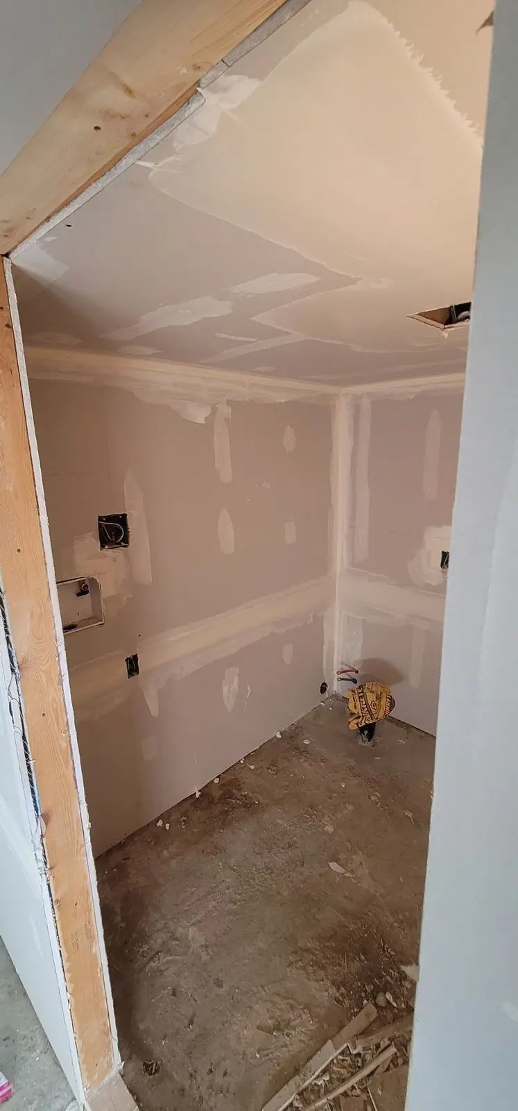 Basement suite bathroom: walk-in shower and stacked laundry, photo 11 of 30 (in progress)