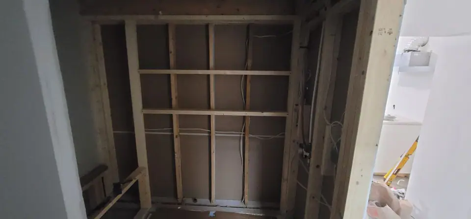 Basement suite bathroom: walk-in shower and stacked laundry, photo 12 of 30 (in progress)