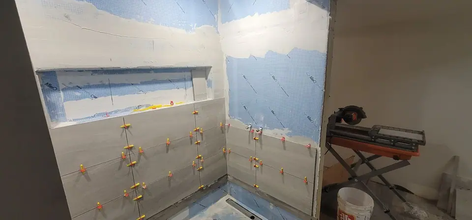 Basement suite bathroom: walk-in shower and stacked laundry, photo 17 of 30 (in progress)