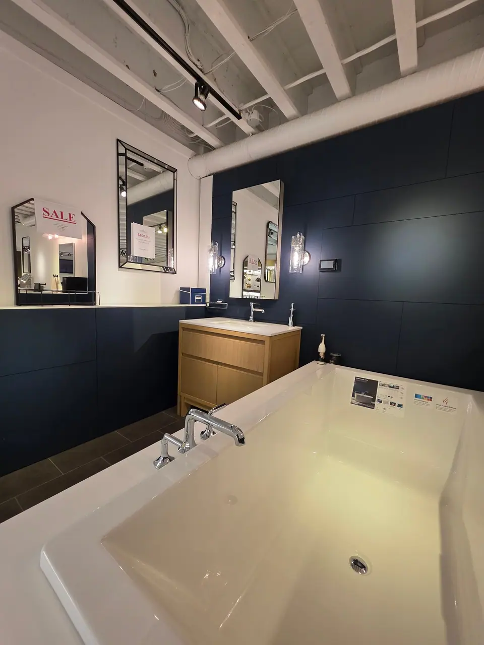 Bathing in a KOHLER fixture showroom