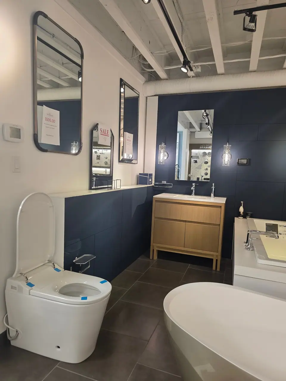 Toilets and bidet seats in a KOHLER fixture showroom