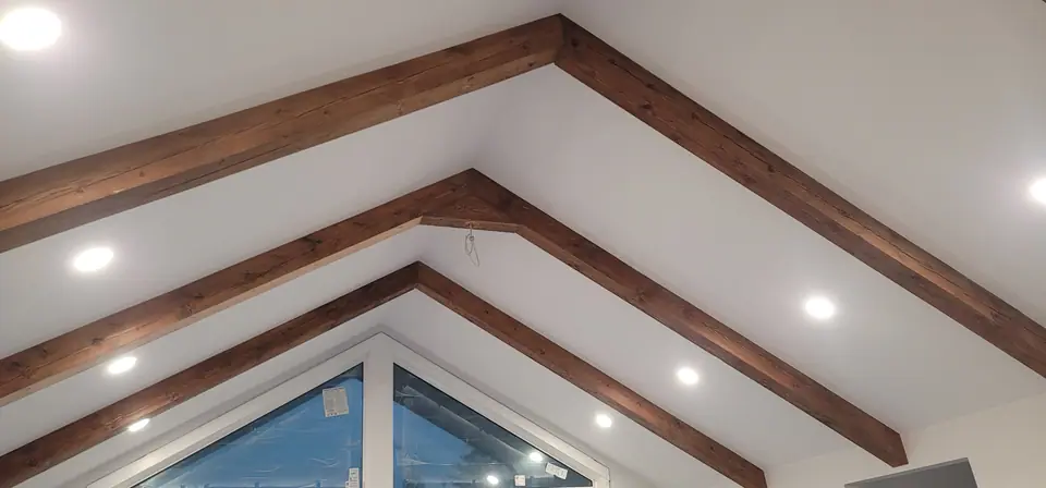 Heavy solid cedar beams on a vaulted ceiling