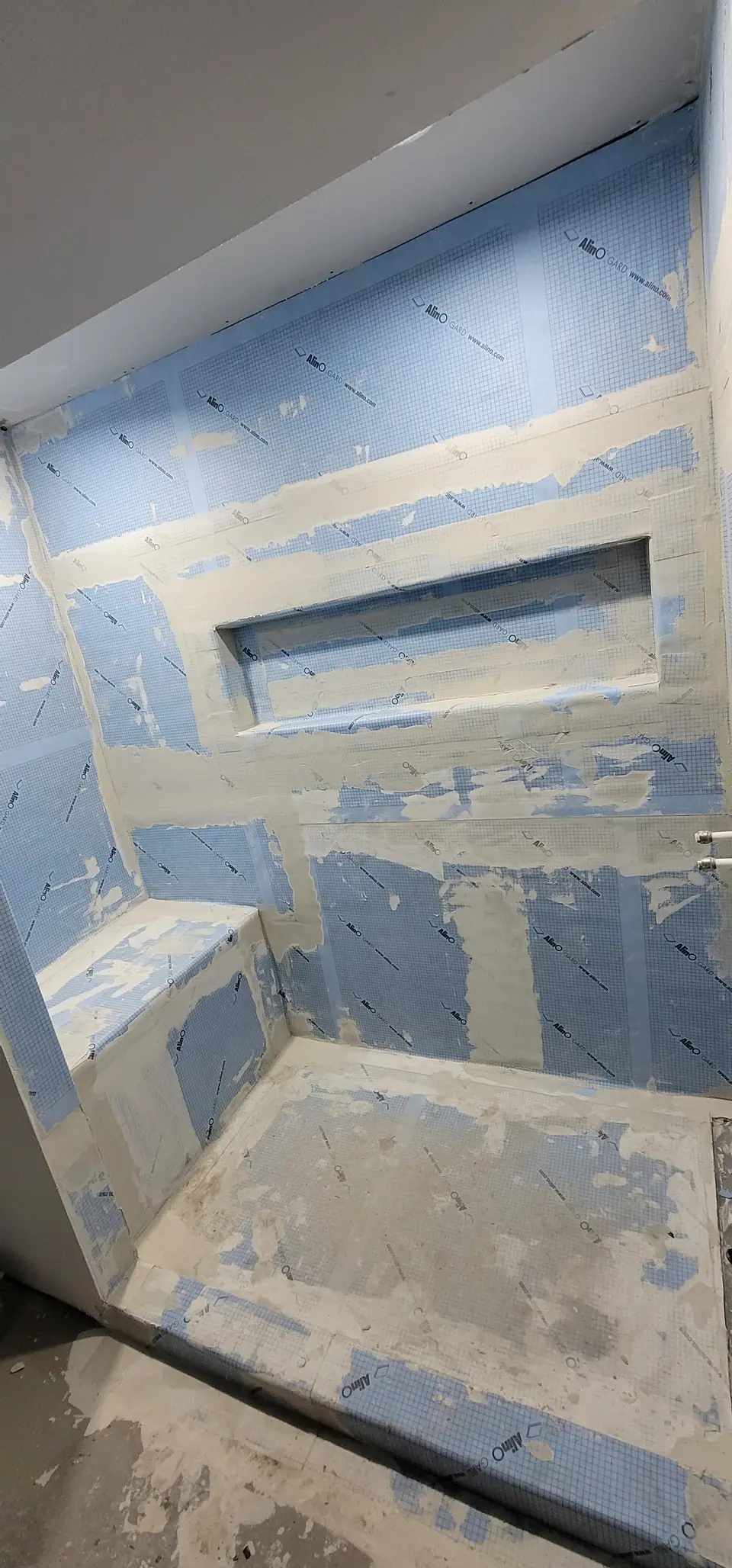 Membrane on, bench and niche formed, before a single tile